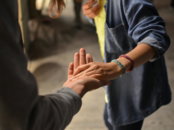 two hands meeting palm to palm